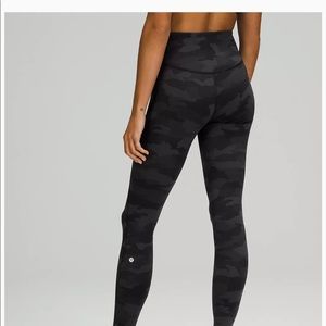 Lululemon base pace tight legging with pocket.  Black/grey camo. Size 8